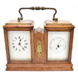 An early 20th century oak cased combination carriage clock/thermometer, each with enamelled dials,