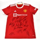 MANCHESTER UNITED; a 2021/22 home shirt, signed by B. Fernandez, Telles, Ronaldo, Maguire, Fred,