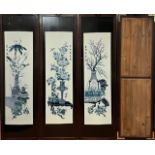 A set of three 20th century blue and white panels representing the seasons, each hand painted and