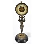 An early 20th century bronzed metal figural aneroid barometer, modelled with the circular