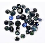 SAPPHIRE; a group of round facet cut stones weighing 30.15ct.