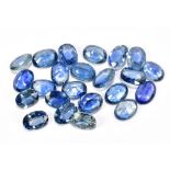 SAPPHIRE; a group of oval facet cut stones weighing 21.40ct, each 7mm x 5mm.