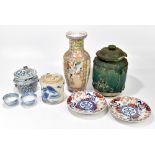 A mixed lot of Chinese and Japanese ceramics including a green glazed rice jar and cover with