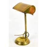 An Edwardian patent Anglepoise type students lamp, with circular base, height 41cm. Additional