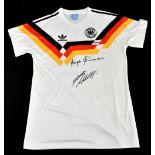 GERMANY; a 1990 retro style shirt, signed to the front by Klinsmann and Matthaus, size XL.Additional