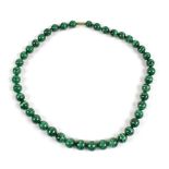 A string of malachite beads, length 50cm.
