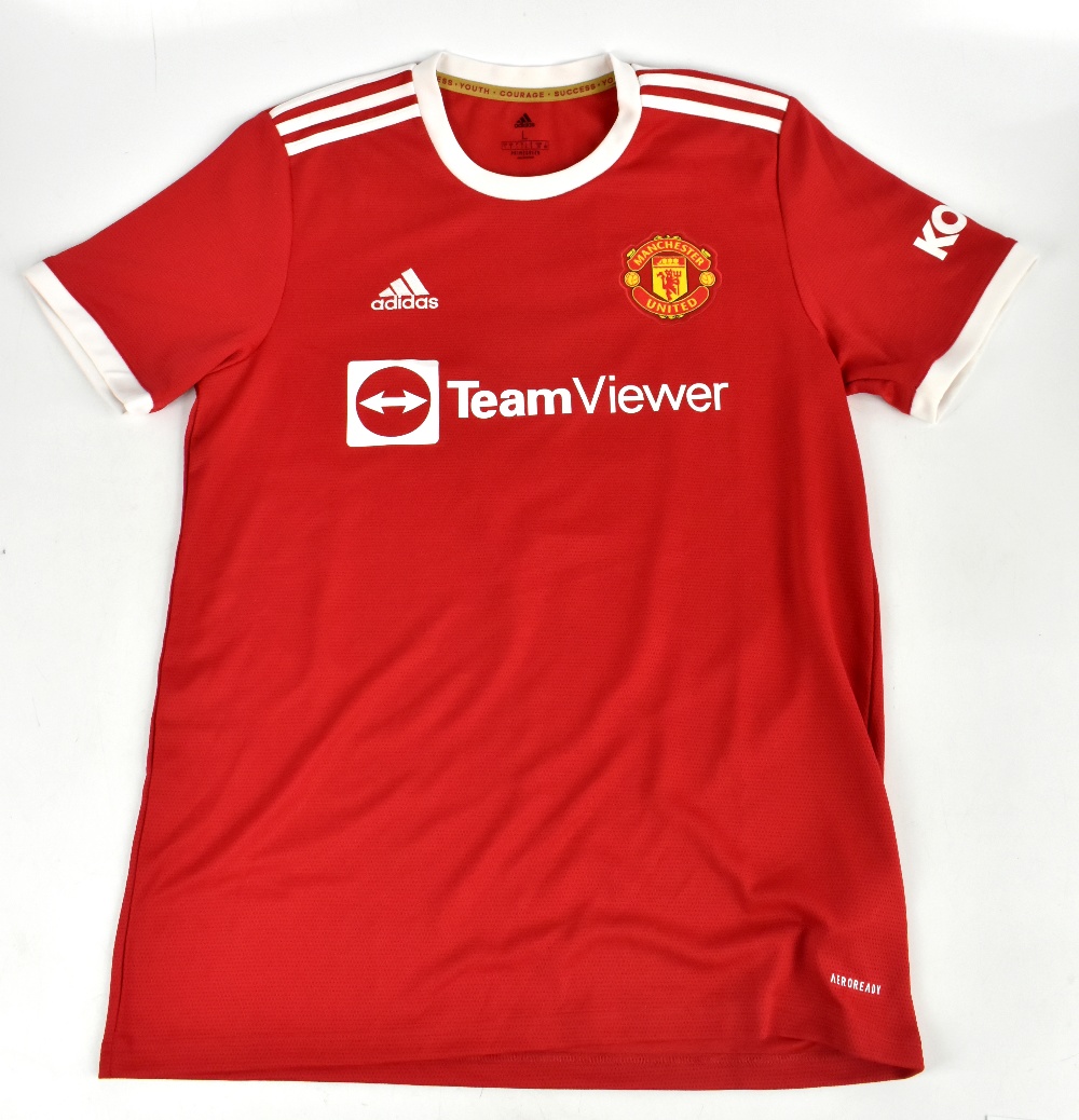 CRISTIANO RONALDO; a Manchester United home shirt, signed to the reverse, size L.Additional