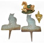 A cast iron horse door stop, also two cat crossing signs and a brass door knocker (4).