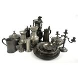 A collection of 19th century and later Continental and English pewter including various flagons, one