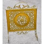 An Arts & Crafts pierced and engraved brass fire screen decorated with flowers, height 26cm.