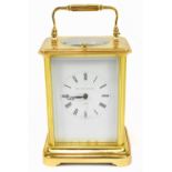 MATTHEW NORMAN; a gilt brass repeating carriage clock, the enamelled dial set with Roman numerals on