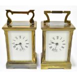 WJ HUBER; two early 20th century brass plated cased carriage clocks, each with enamelled faces and