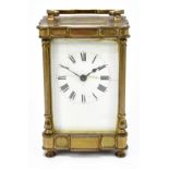 A late 19th century French brass cased carriage clock, the enamelled dial set with Roman numerals,