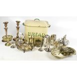 A selection of silver plated items, including a pair of Adam style candlesticks and enamelled