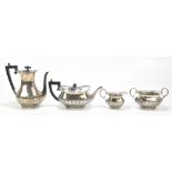 WILLIAM HUTTON & SONS; a Victorian and later four piece matched tea service with gadrooned