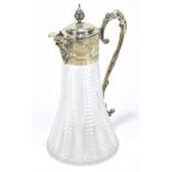 A cut glass and silver plate mounted claret jug of tapering form with grape and vine decoration to