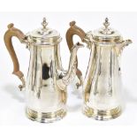 VINERS; a hallmarked silver coffee pot and hot water pot, with carved wood handles, London 1967,