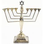 TAITE & SONS; a hallmarked silver menorah, on stepped square base, London 1971, 11.4ozt/359g, height