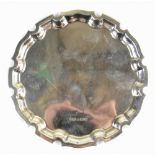 A hallmarked silver waiter, with shaped rim, Birmingham 1998, 3.4ozt/108g, diameter 15.5cm (1).