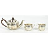 MAPPIN & WEBB; a George V hallmarked silver three piece bachelor's tea set, comprising teapot, sugar