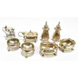 WALKER & HALL; an Edward VII hallmarked silver five piece cruet, Sheffield 1906-10, a pair of