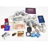 A collection of British and Continental coinage and bank notes, including commemorative crowns,