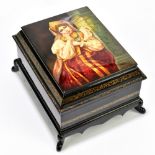 A Russian Fedoskino papier-mâché hand painted lacquered box of rectangular form, the hinged lid