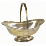 HOLLAND, ALDWINCKLE & SLATER; an Edward VII hallmarked silver oval basket with swing handle,