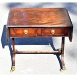 A reproduction mahogany veneered drop-leaf coffee table with two drawers on splayed feet, width