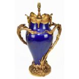 A large dark blue glazed French baluster vase, ormolu mounted as a lamp with pierced scrolling