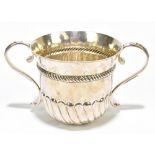 A Britannia standard George V hallmarked silver porringer with part gadrooned decoration and twin