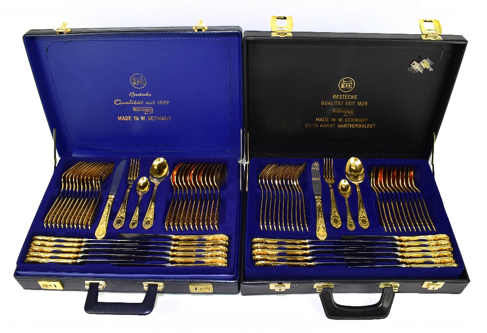 SOLINGEN; two briefcase cased sets of cutlery.