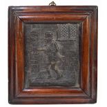 A small embossed plaque, possibly pressed leather, depicting a gentleman wearing a top hat in