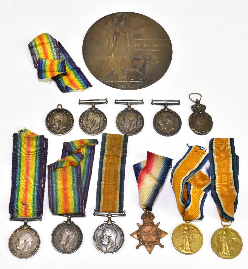 A WWI bronze memorial plaque awarded to Harold Brierley, with three WWI period medals awarded to