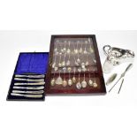 A collection of eighteen hallmarked silver and sterling silver collectors' spoons, many with