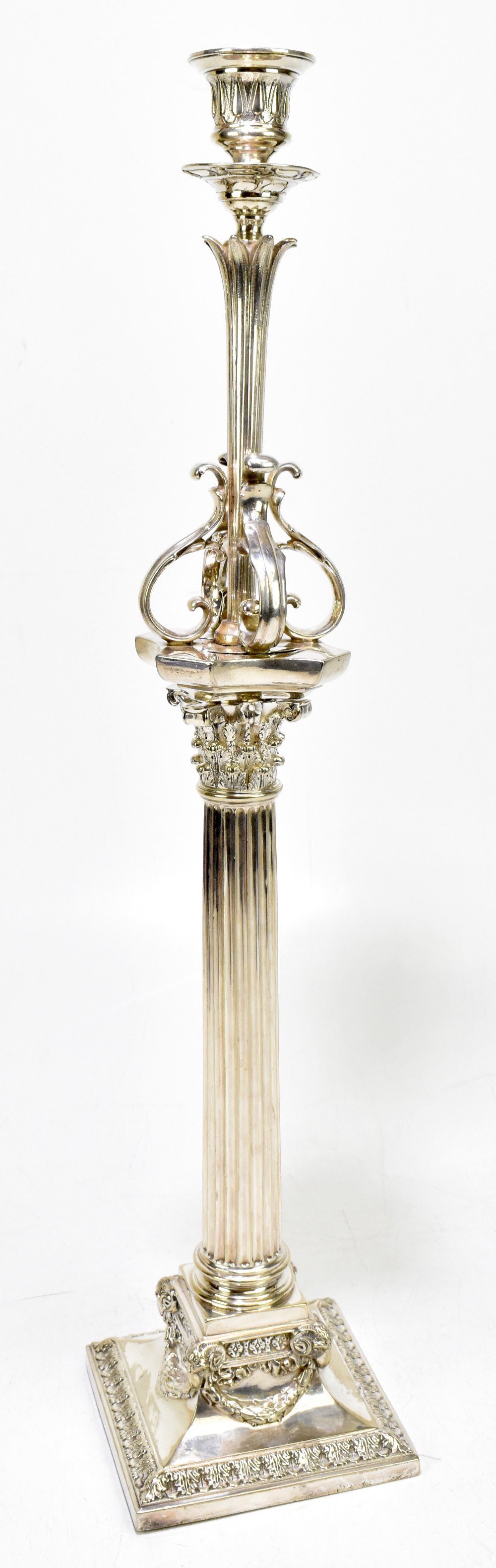 A late 19th century silver plated Corinthian column candlestick with detachable top section raised