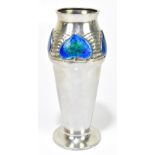 ARCHIBALD KNOX for TUDRIC; a pewter vase with flared neck with four enamelled heart shaped