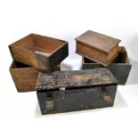 A black painted tin ammunition crate, with four wooden crates, one labelled 'Explosives'.