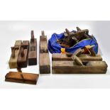 A collection of woodworking wooden planes, one stamped J. Smale.