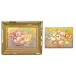 A pair of late 19th century Continental porcelain rectangular plaques, each painted with a still