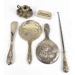 An assortment of silver items including two hallmarked silver hand mirrors, one decorated with