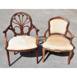 A reproduction Chippendale Revival elbow chair on turned column supports,and a French style open