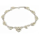 A sterling silver necklace with cast floral decoration in the Art Nouveau style, length 40cm,