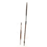 A Masai wrought iron and wood spear, length 161cm, with two smaller African spears (3).Additional