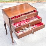 VINERS; a canteen of silver plated King's pattern cutlery, in a three drawer chest with other plated