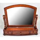 A reproduction mahogany dressing table mirror with three base drawers, the handles inlaid with