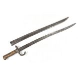 A French chassepot bayonet and scabbard, length 71cm.