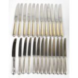 Twenty-four hallmarked silver handled Old English pattern table and dessert knives, with stainless