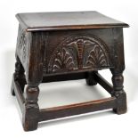 An 18th century and later oak joint stool of rectangular form, the hinged seat enclosing storage