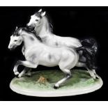 GLORIETTE KERAMIK; a large Austrian figure group of two horses on oval base, printed marks and no.